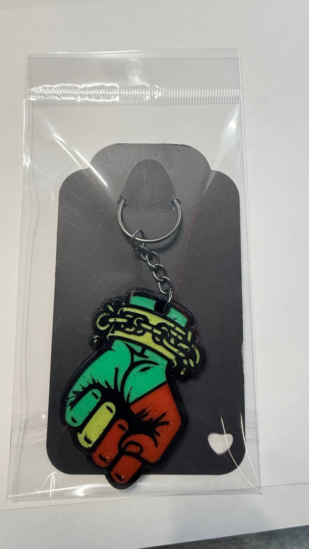 FLY-OG 3D Juneteenth Fist of Power keychain, red, black, and green Pan-African colors, raised fist with broken chains.