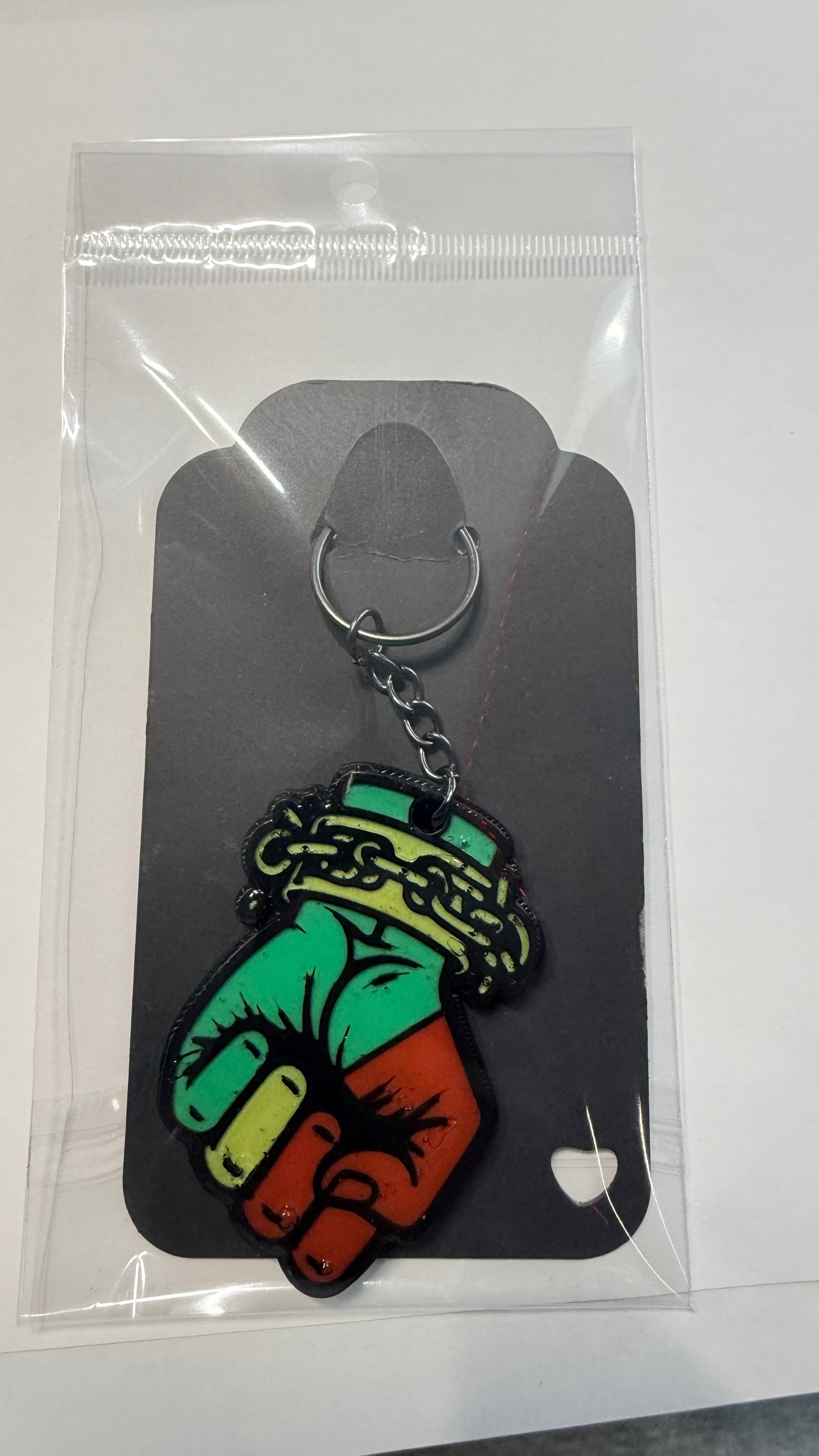 FLY-OG 3D Juneteenth Fist of Power keychain, red, black, and green Pan-African colors, raised fist with broken chains.
