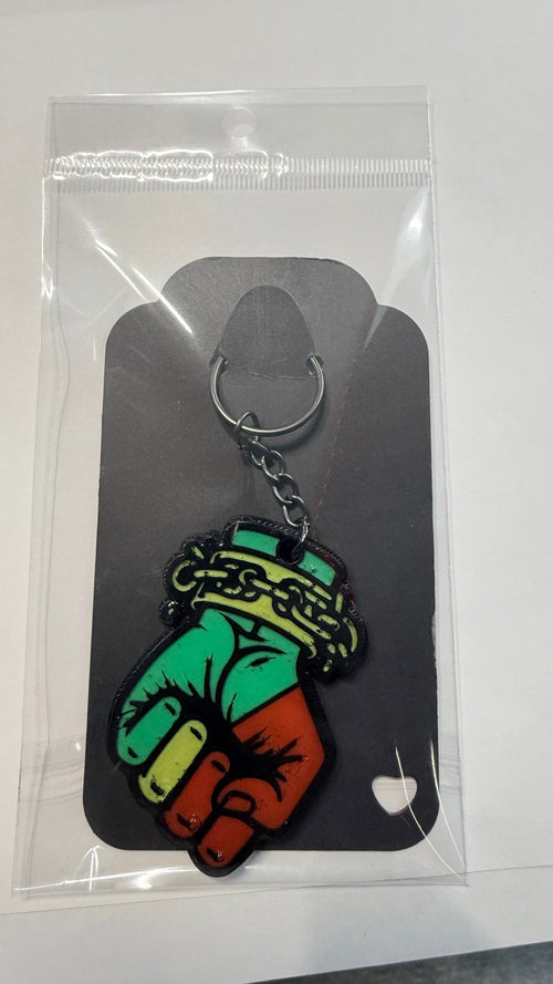 FLY-OG 3D Juneteenth Fist of Power keychain, red, black, and green Pan-African colors, raised fist with broken chains.