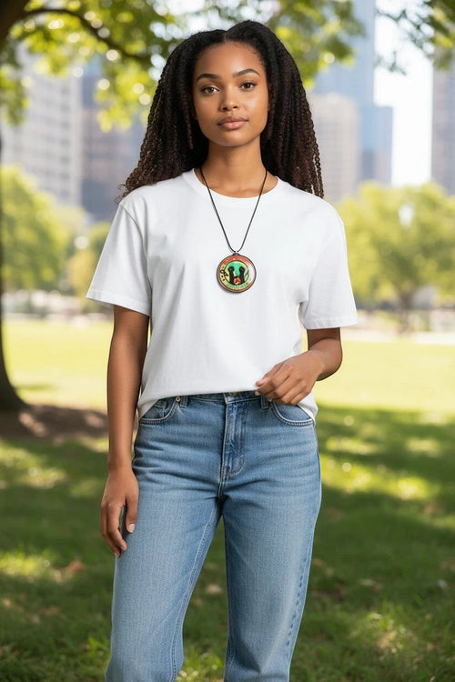FLY-OG 3D Juneteenth Freedom Medallion pendant necklace with raised fists and broken chains on a black cord.